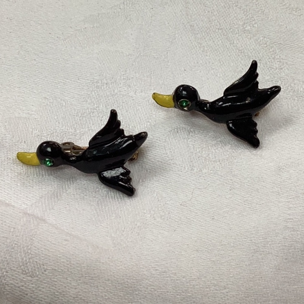 Vintage black enamel duck pins with green crystal eyes